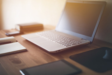workplace desk laptop computer notebook on table.