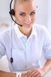 © lenets_tan - Close-up portrait of a customer service agent sitting at office