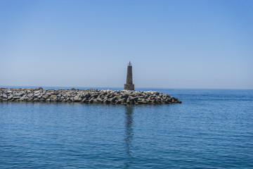 Wall Mural - ocean lighthouse tower at the seaside of Marbella in Spain