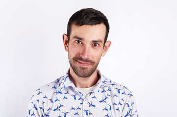 Man portrait over white background smiling. Black hair and facia