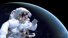 Close Up Of An Astronaut In Outer Space, Earth By Night In The Background. Elements Of This Image Are Furnished By NASA
