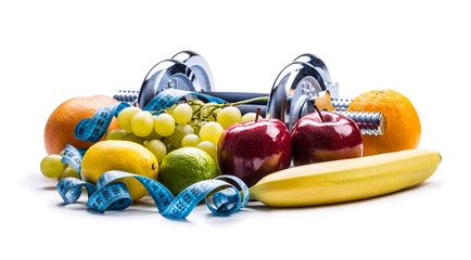 Wall Mural - Chrome dumbbells surrounded with healthy fruits measuring tape on a  white background with shadows. Healthy lifestyle diet and exercise.