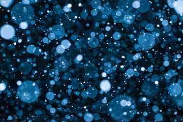 falling snow on the blue background
