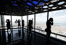 Tourists Looking At Dubai Cityscape From A High Vantage Point, U