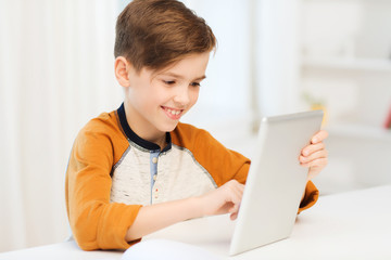 Canvas Print - smiling boy with tablet pc computer at home