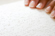 © xixinxing - Woman reading braille