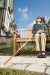 © xixinxing - Blind woman sitting on a bench