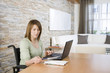 © xixinxing - Disabled woman telecommuting