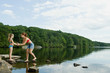 © xixinxing - Mother and daughter in stone in lake