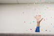 Leinwandbild Motiv Businessman throwing confetti in the air