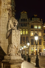 Wall Mural - Stone lion decorating entry to medieval city hall on Grand Place in Brussels, Belgium