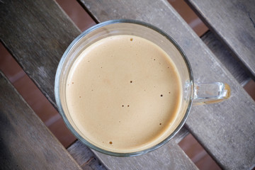 Cup of coffee on wooden table