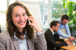 © Production Perig - Young attractive businesswoman working at the office with associ