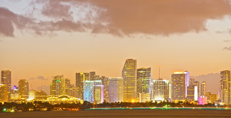 Wall Mural - Miami Florida skyline of downtown colorful buildings lights and beautiful sunset