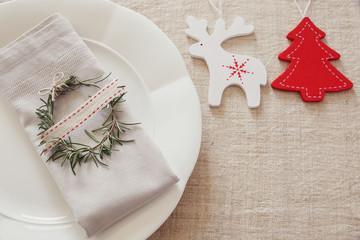Wall Mural - Christmas table place setting, holidays copy space background, selective focus, vintage tone