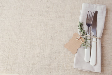Wall Mural - Table place setting with rosemary and empty tag, copy space background