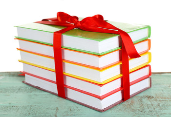 Canvas Print - Stack of books with ribbon on light background