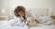 © Dash - Woman Is Holding A Dog On A Bed