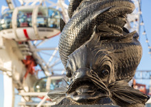 Carving Of Fish On Riverbank By London Eye