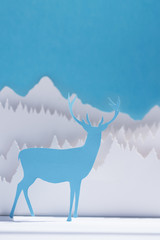 Paper cut deer handmade craft holiday blue card