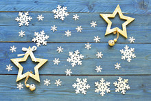 Snowflakes  And Stars On Blue  Wooden Background