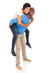 Wall Mural - african american couple piggyback