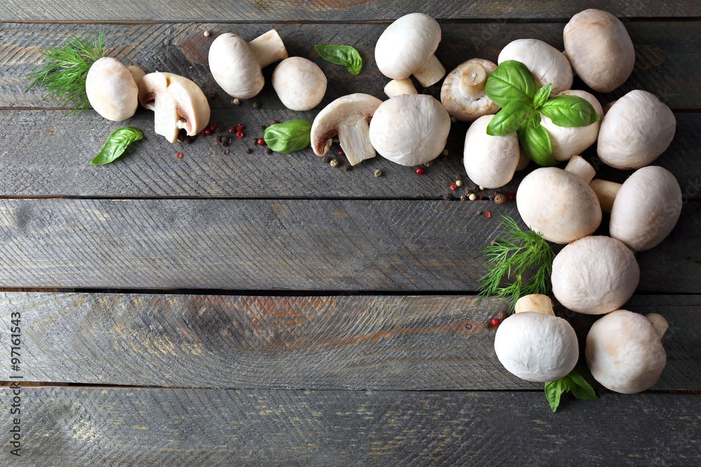 Fresh mushrooms on wooden background