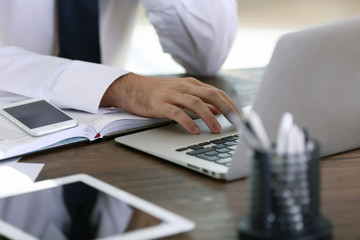 Wall Mural - Man working with laptop in office