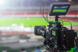 Fototapeta  - video camera recording in a football game