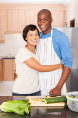 Wall Mural - young black couple cooking in kitchen