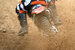 Flying debris from a motocross in dirt track