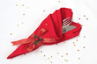 Knife and Fork wrapped in red linen napkin