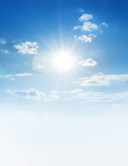 Wall Mural - blue sky with clouds and sun.