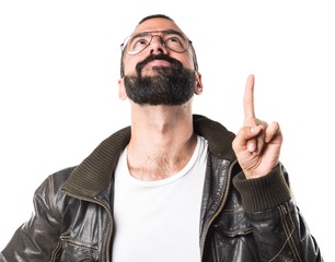 Wall Mural - Man wearing a leather jacket pointing up