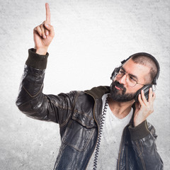 Wall Mural - Man wearing a leather jacket listening music