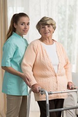 Wall Mural - Professional carer helping old lady