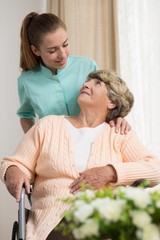 Canvas Print - Elderly woman on a wheelchair