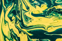 Yellow And Green Paint Flowing And Mixing Texture.