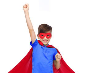 Wall Mural - boy in red super hero cape and mask showing fists