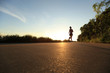 © lzf - young fitness woman running on sunrise seaside trail