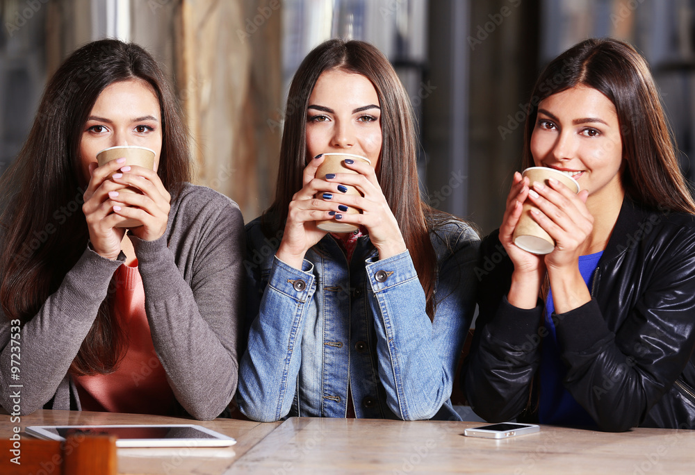 Best friends together sitting at cafes terrace