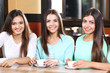 © Africa Studio - Beautiful girls together in cafe