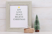 Christmas Poster In  Shabby Chick Frame, Fir And Vintage Gift Box With With Copy Space Blank Tag On White Background. Scandinavian Style Home Interior Decoration