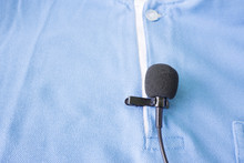 Close-up Of  Holding A Wireless Lavalier Microphone
