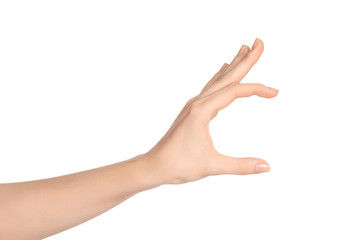 Beauty and Health theme: beautiful elegant female hand show gesture on an isolated white background in studio