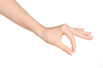 beauty and health theme: beautiful elegant female hand show gesture on an isolated white background 