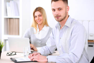 Two successful business partners working at meeting in office