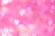 Abstract blur heart shape bokeh on pink background