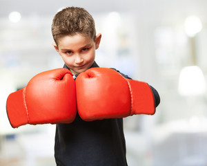 Wall Mural - little kid fighting with red boxing gloves