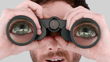 Poster - Man looking through binoculars 